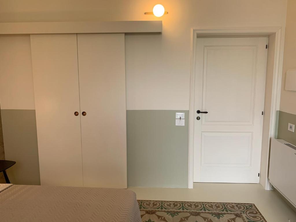 Postel nebo postele na pokoji v ubytování Il Sogno di Mimì