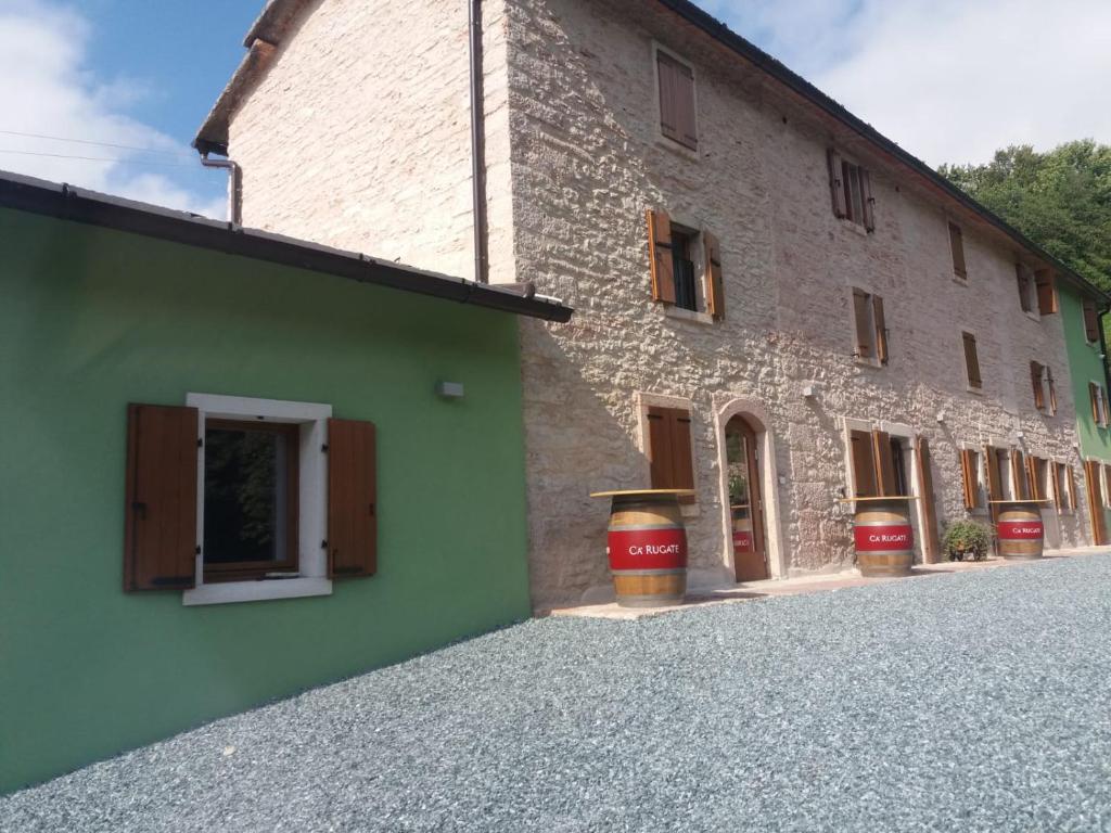 a large brick building with a window on the side of it at Rifugio Cuneck in Velo Veronese