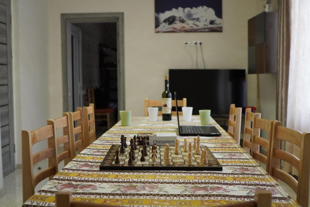 a table with a chess board on it at Aragats Hostel & Guest House in Gyumri