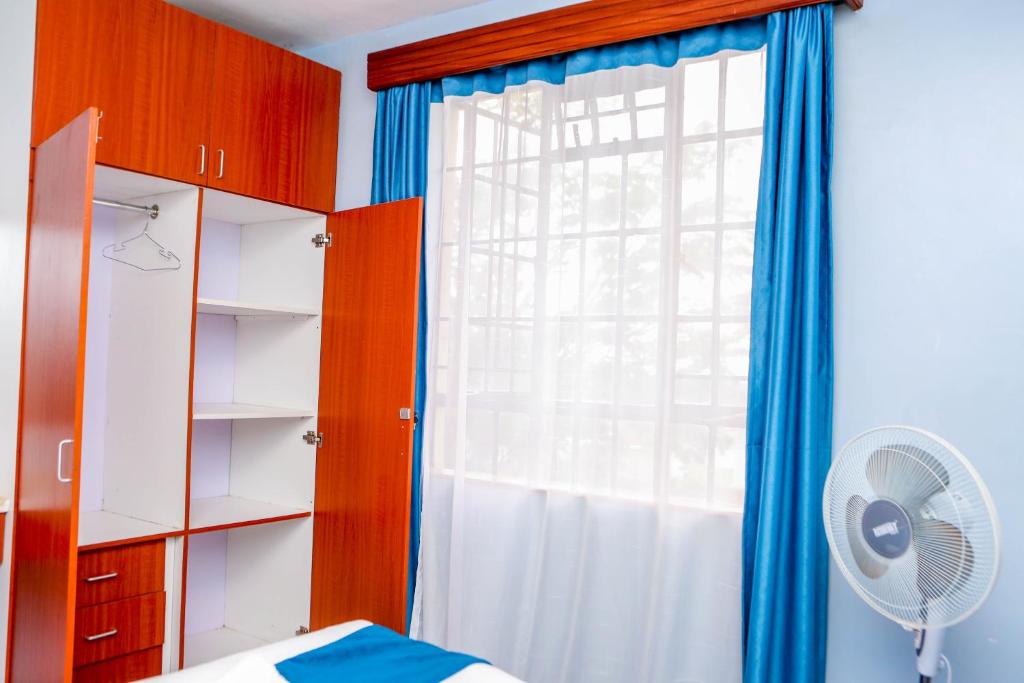 Postel nebo postele na pokoji v ubytování Tiamcy homes