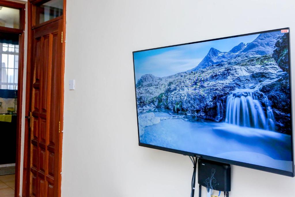 TV a/nebo společenská místnost v ubytování Tiamcy homes