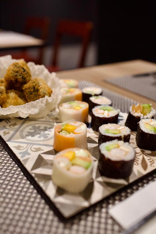 a tray of sushi and pastries on a table at ONOMO Hotel Tanger Med in Tangier