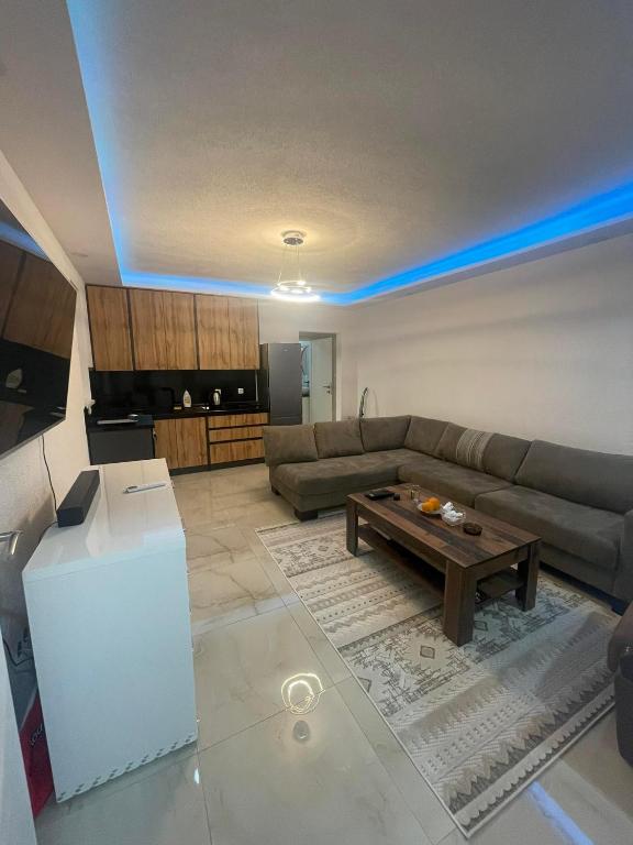 a living room with a couch and a table at Chill Apartment in Sarajevo