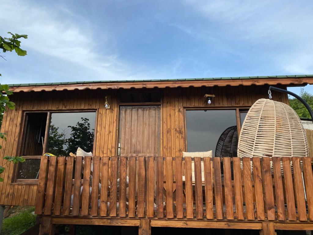 a wooden cabin with a fence in front of it at Akçakoca ağaç ev in Duzce