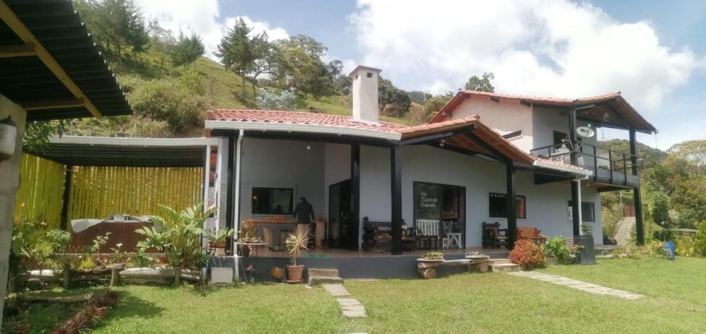 a villa with a view of the house at Soki in Guatapé