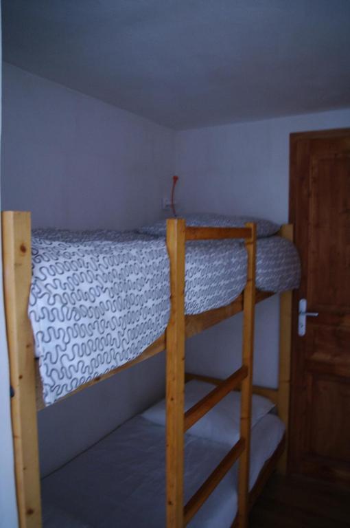 Postel nebo postele na pokoji v ubytování Appartement Dans Chalet de Montagne
