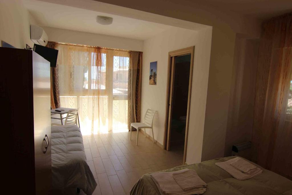 Postel nebo postele na pokoji v ubytování B&B Le Dune Beach