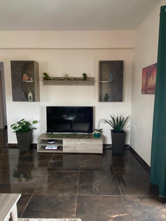 a living room with a flat screen tv at Natalie’s House in Alexandroupoli