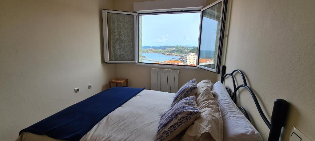 Postel nebo postele na pokoji v ubytování El Azulin de Candás con Wifi Incluido