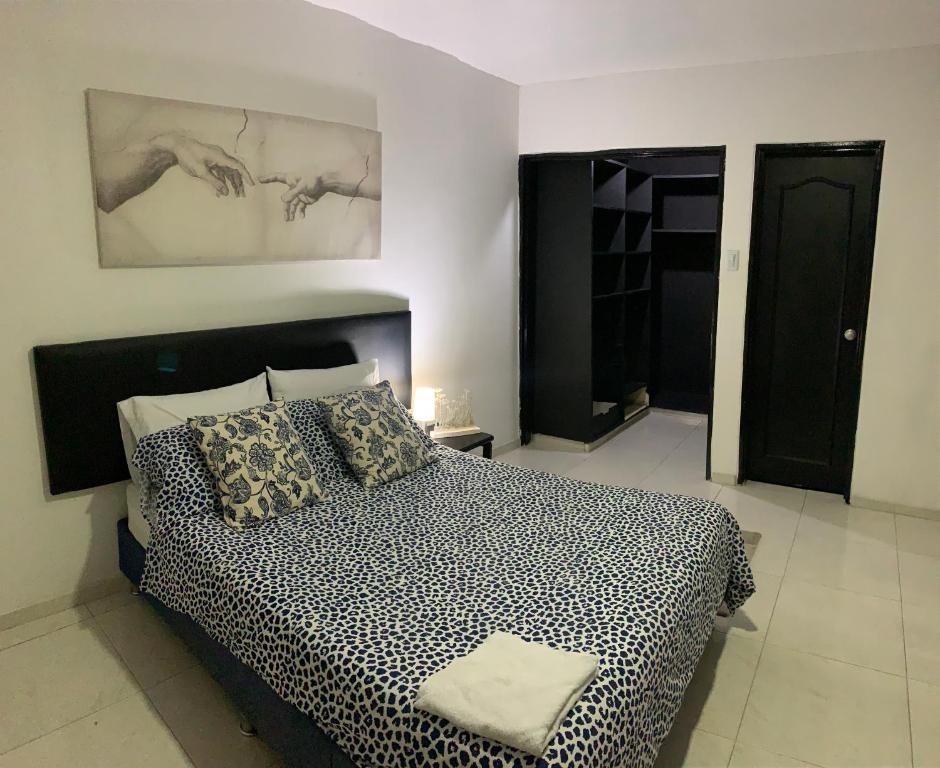 Postel nebo postele na pokoji v ubytování El Rincón de Granada Casa de Huespedes