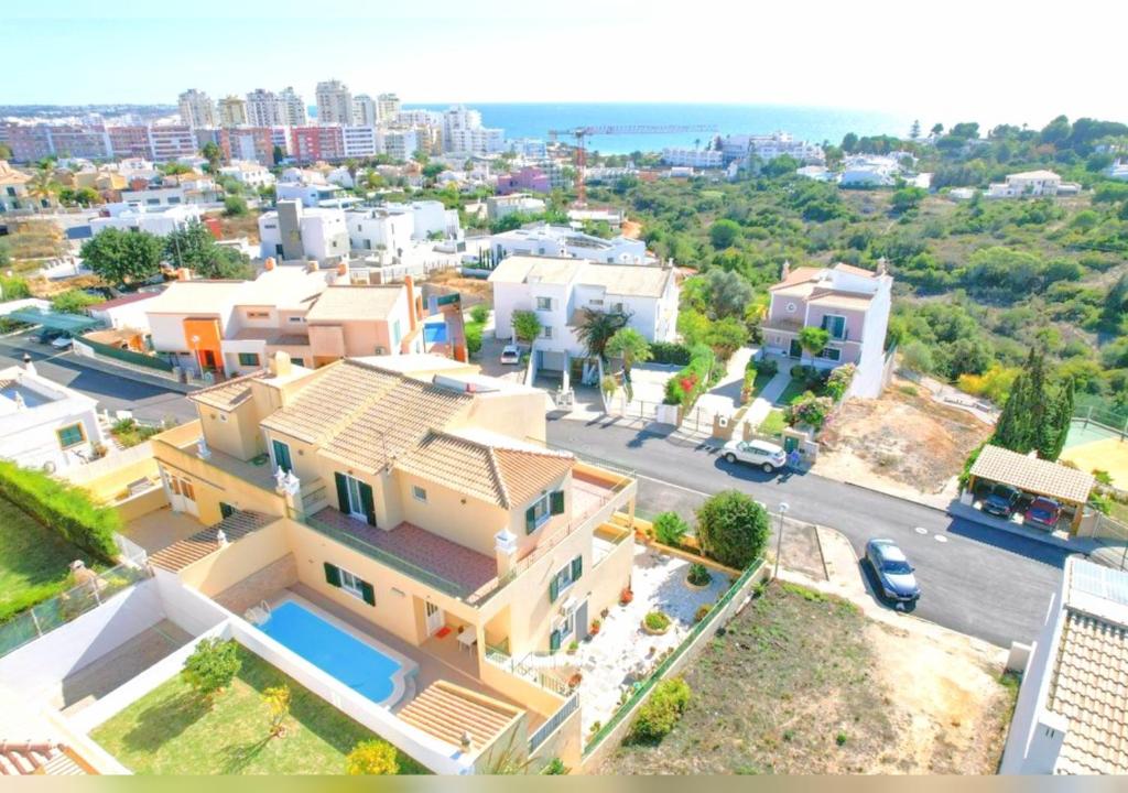 an aerial view of a house in a city at Olival Beach Villa with Pool walking distance to Beach in Armação de Pêra