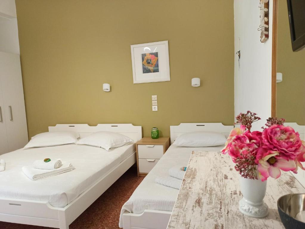 Postel nebo postele na pokoji v ubytování Apartments Papadioti