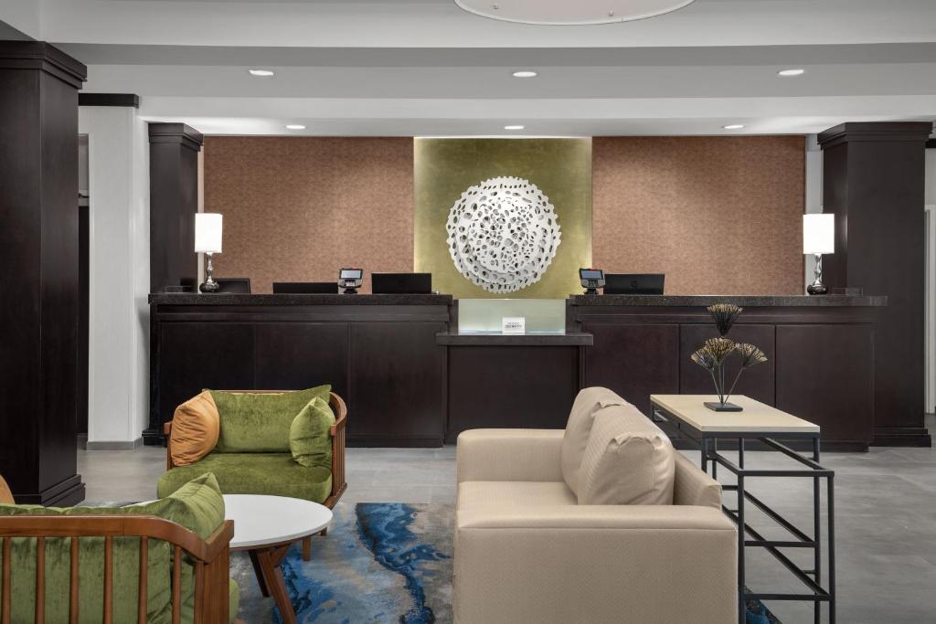 a lobby with two chairs and a waiting room at Fairfield by Marriott Tacoma Puyallup in Puyallup