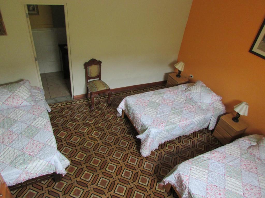 Postel nebo postele na pokoji v ubytování Residencial Miraflores B&B