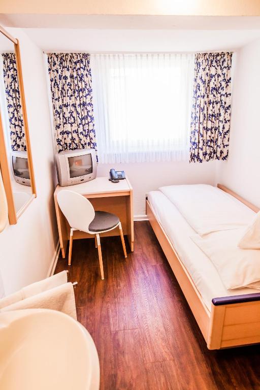 Postel nebo postele na pokoji v ubytování Hotel Martinihof