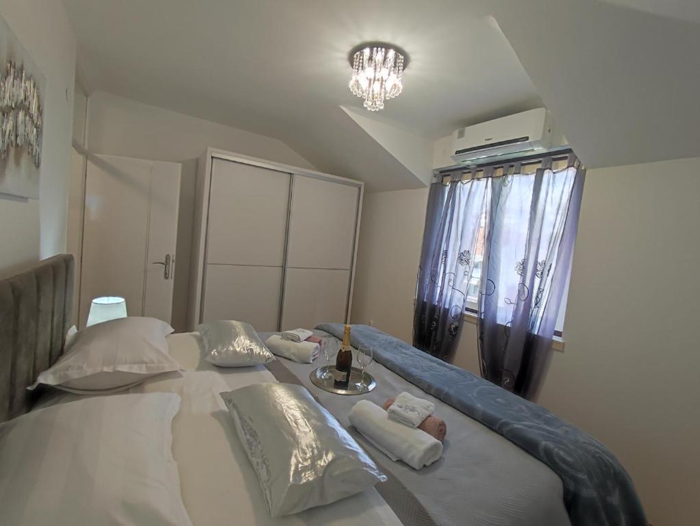 Postel nebo postele na pokoji v ubytování Apartman Oaza - Ploče, Croatia