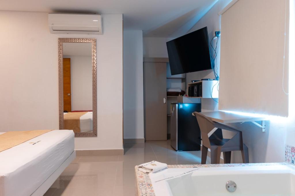 Postel nebo postele na pokoji v ubytování Infinity Hotel