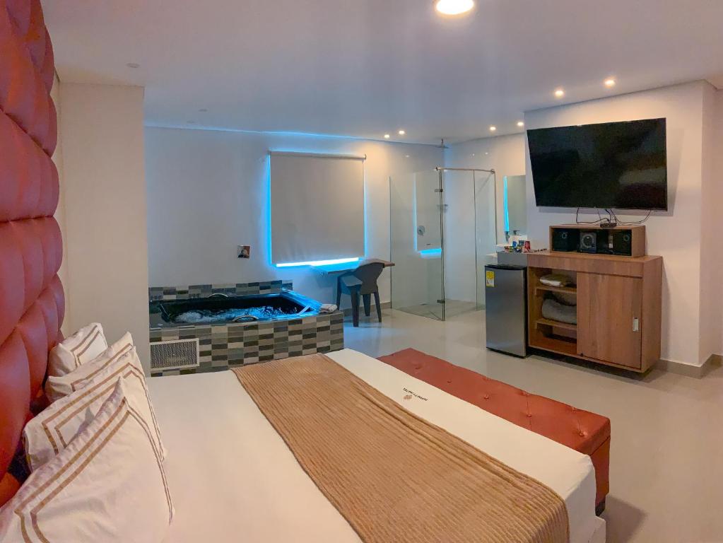 Postel nebo postele na pokoji v ubytování Infinity Hotel