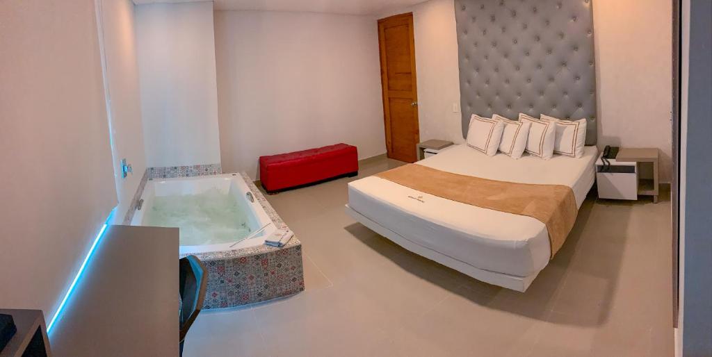 Postel nebo postele na pokoji v ubytování Infinity Hotel