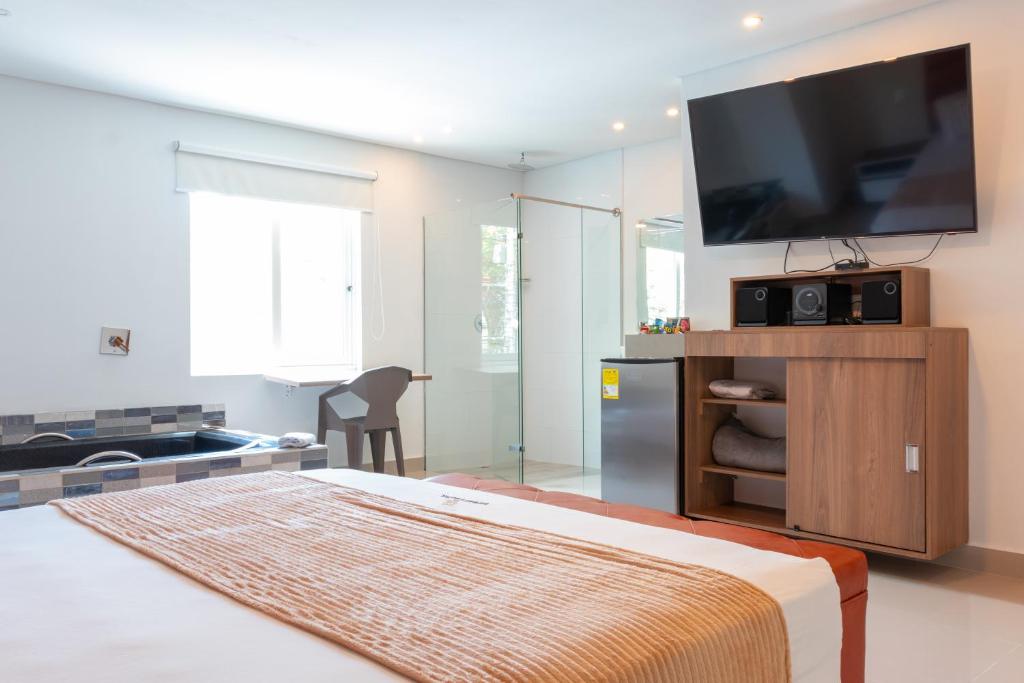 Postel nebo postele na pokoji v ubytování Infinity Hotel
