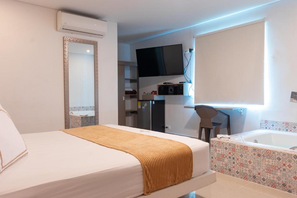 Postel nebo postele na pokoji v ubytování Infinity Hotel