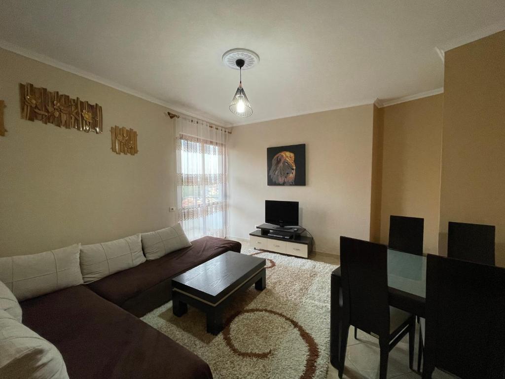 a living room with a couch and a table at B&B - Private rooms 2 in Tirana