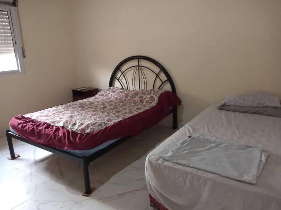 Giường trong phòng chung tại Casa Iberá