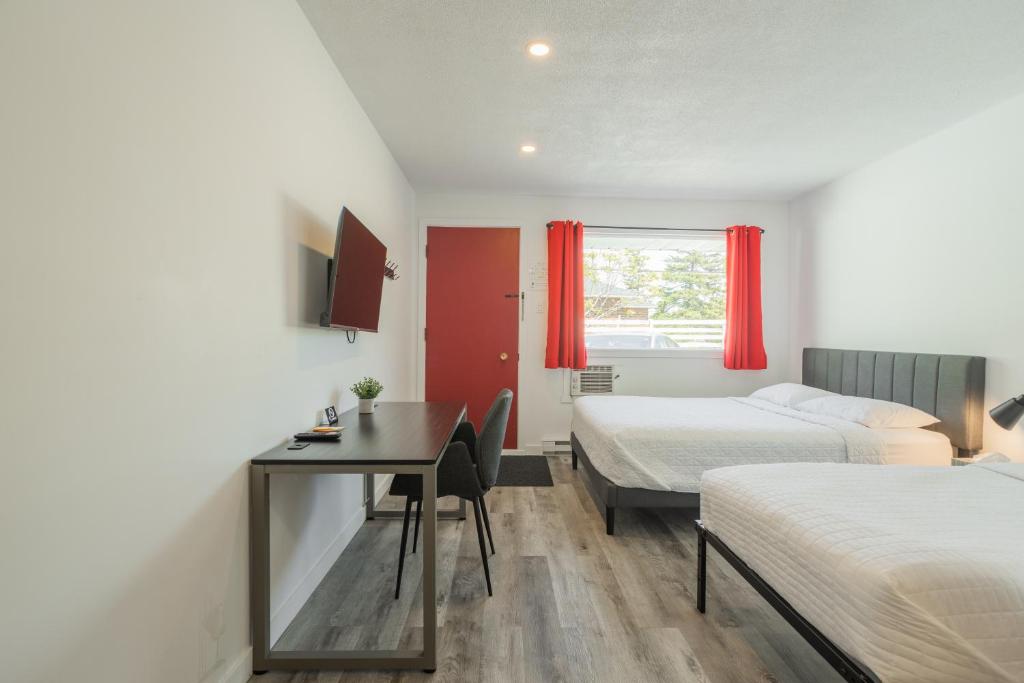 Postel nebo postele na pokoji v ubytování Motel Champlain