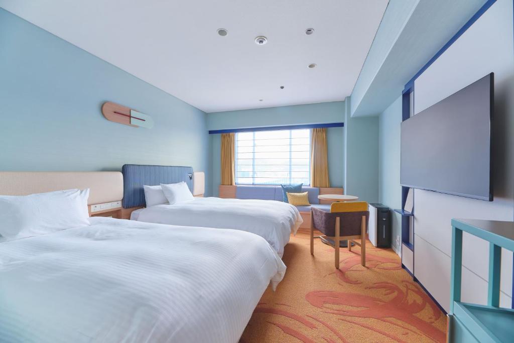 Postel nebo postele na pokoji v ubytování Miyako Hotel Kyoto Hachijo