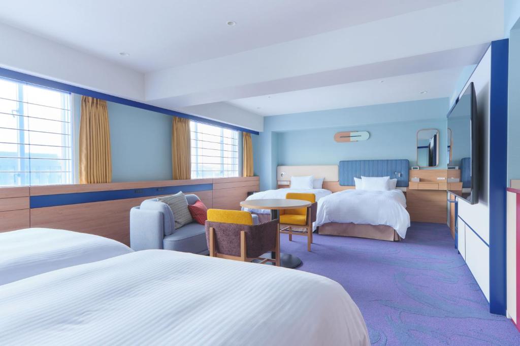 Postel nebo postele na pokoji v ubytování Miyako Hotel Kyoto Hachijo