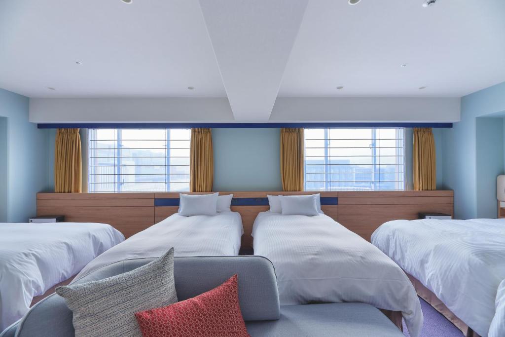 Postel nebo postele na pokoji v ubytování Miyako Hotel Kyoto Hachijo