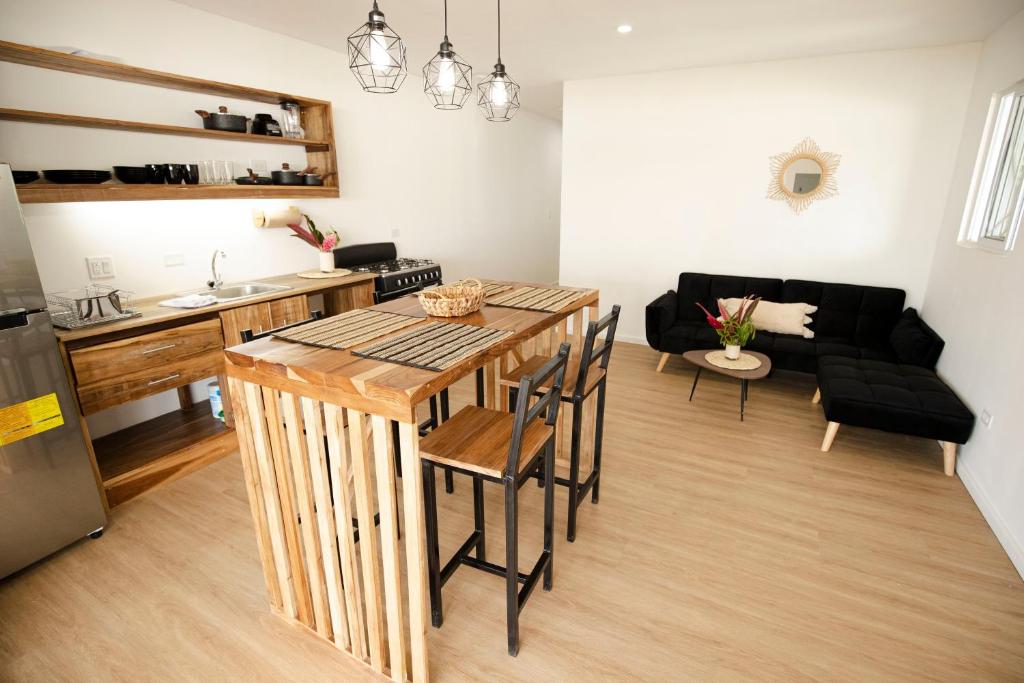 a kitchen and living room with a table and chairs at Casa Arena 2 in Big Creek