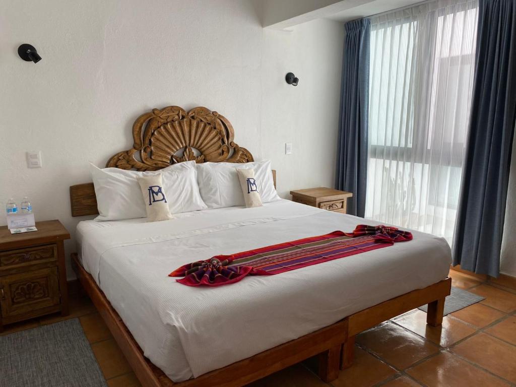 Postel nebo postele na pokoji v ubytování Hotel La Lejona