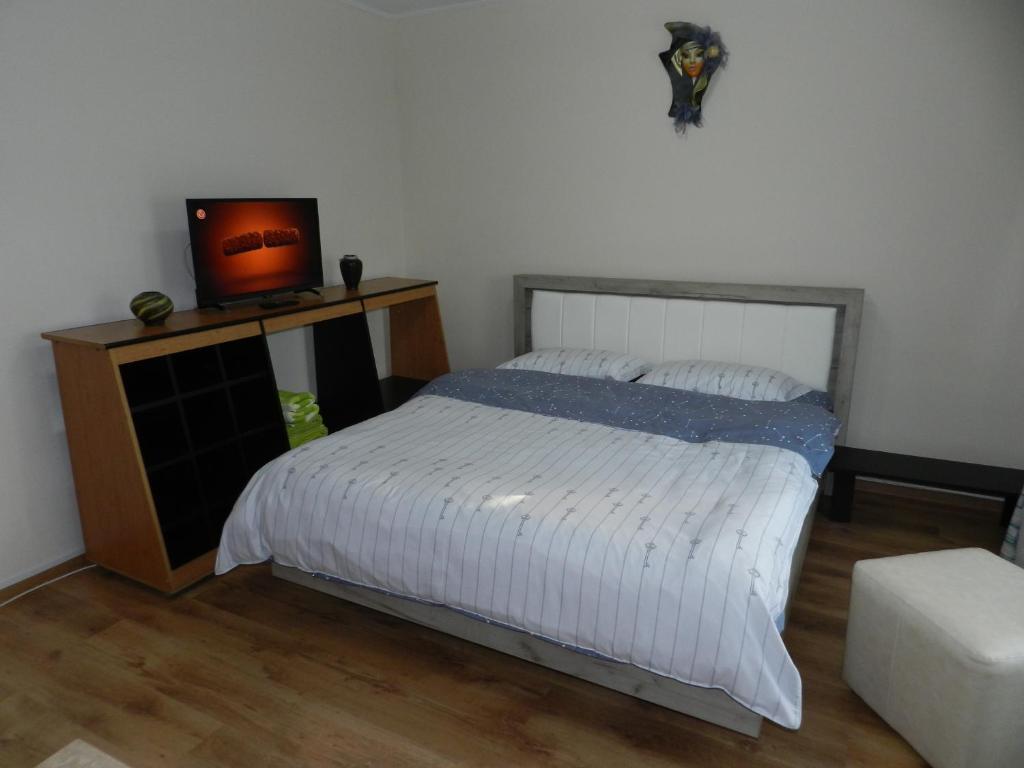 מיטה או מיטות בחדר ב-Apartament Cristina