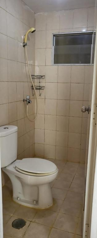 a bathroom with a toilet and a shower at Icon gading in Jakarta