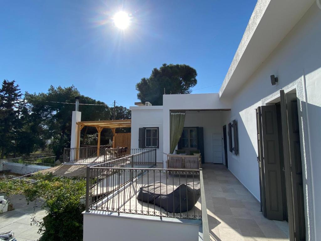 En balkon eller terrasse på Maria’s Cottage House