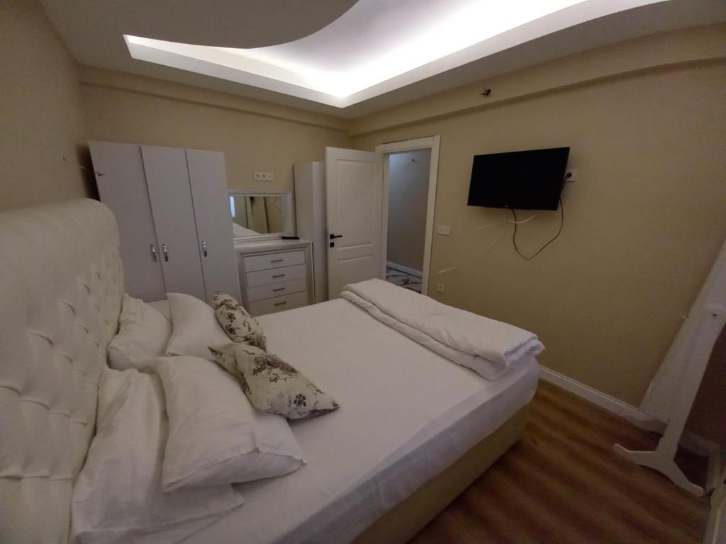 Postel nebo postele na pokoji v ubytování Dilmac Hotel