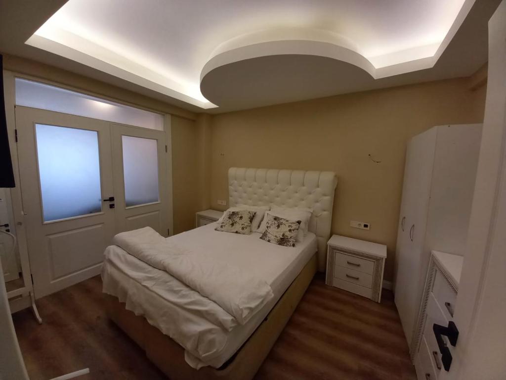 Postel nebo postele na pokoji v ubytování Dilmac Hotel