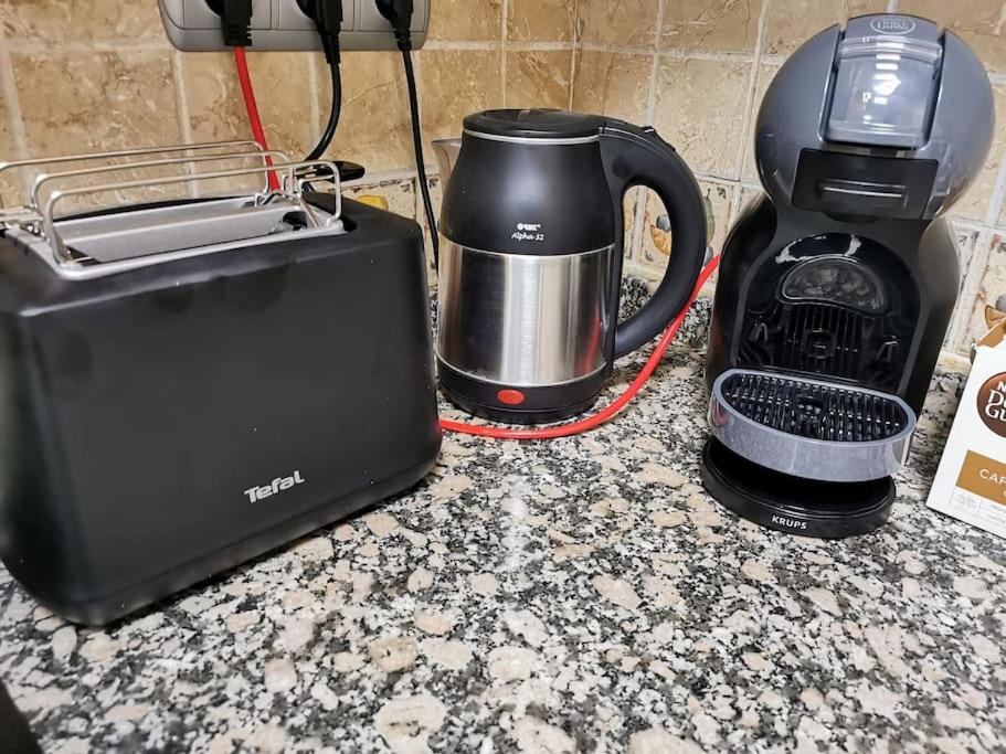 Příslušenství pro přípravu čaje a kávy v ubytování Apartamento Playa Cura