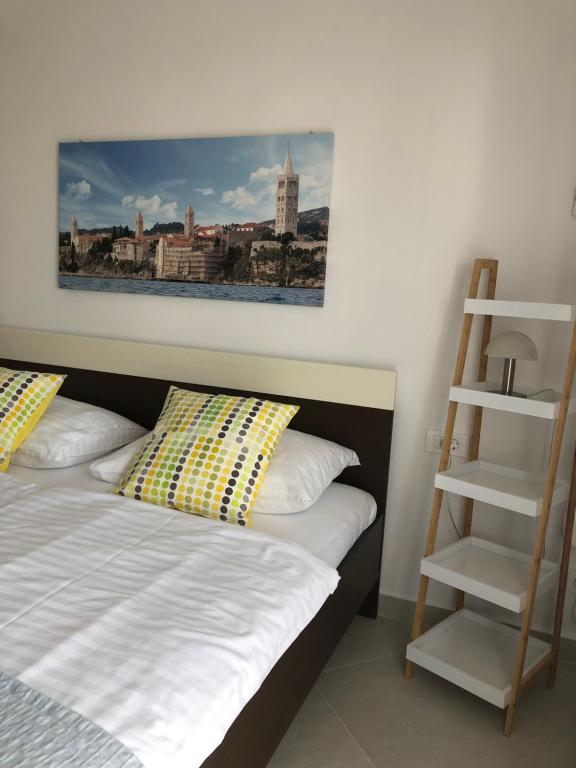 Postel nebo postele na pokoji v ubytování Apartments Aco