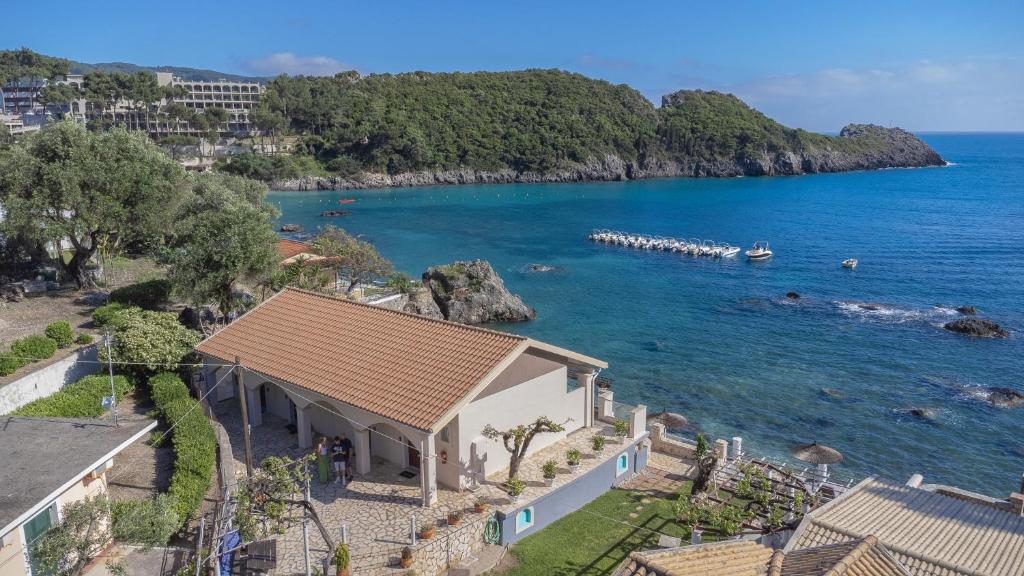 a house with a view of the ocean at Thomas Beach Studios in Paleokastritsa