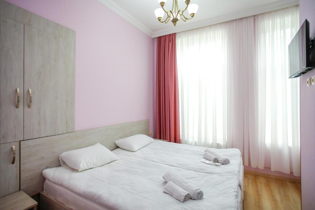 Postel nebo postele na pokoji v ubytování city point