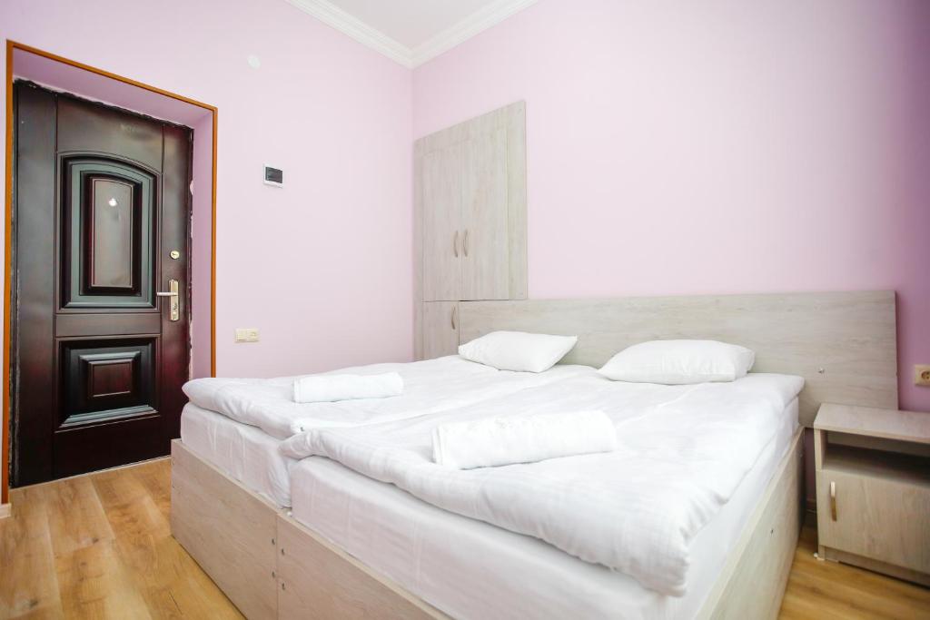 Postel nebo postele na pokoji v ubytování city point