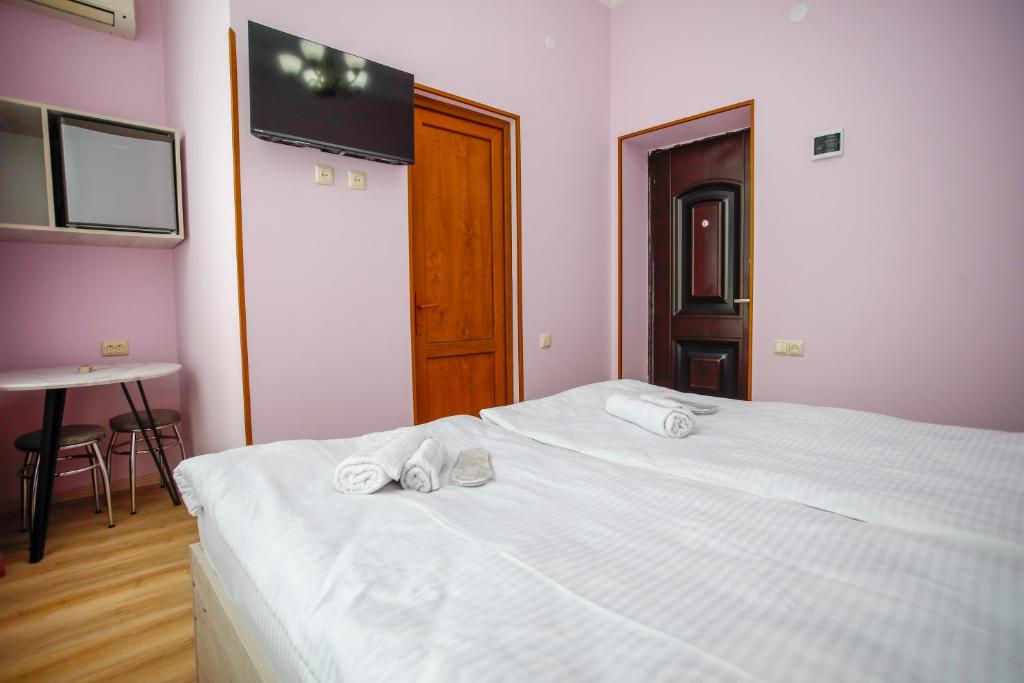 Postel nebo postele na pokoji v ubytování city point