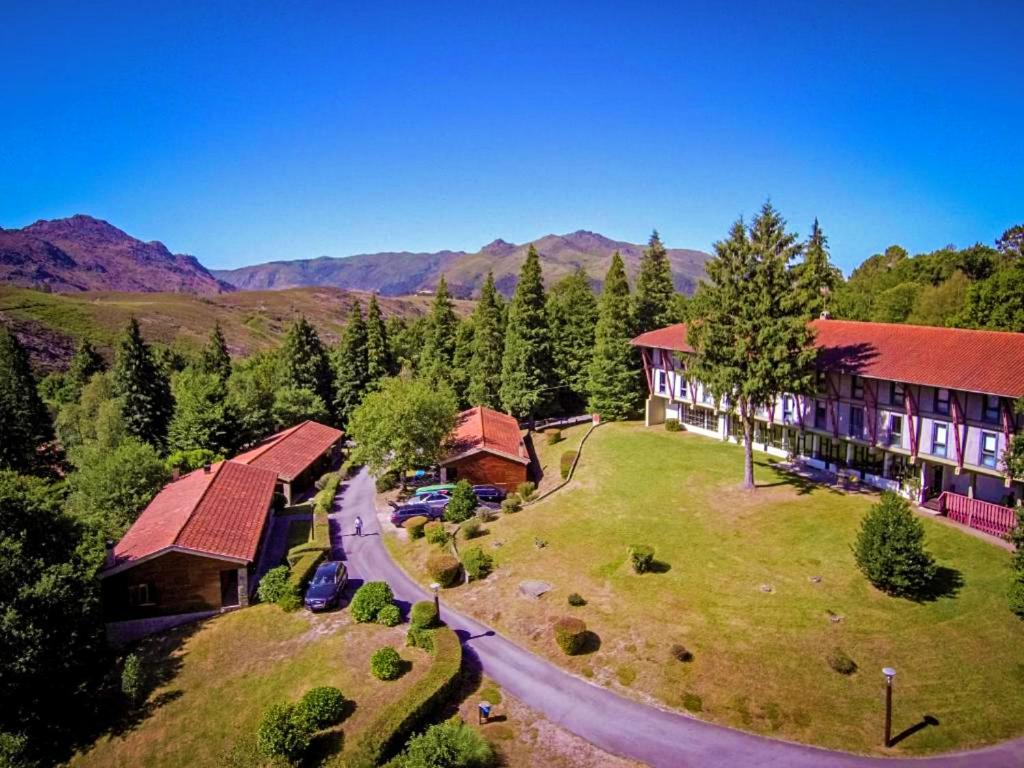 an aerial view of a resort with mountains in the background at HI Geres - Pousada de Juventude do Gerês in Geres