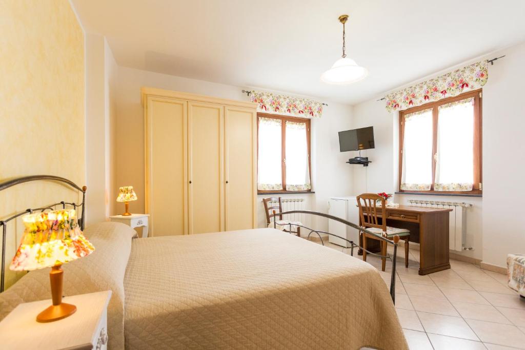 Postel nebo postele na pokoji v ubytování Agriturismo Daniela