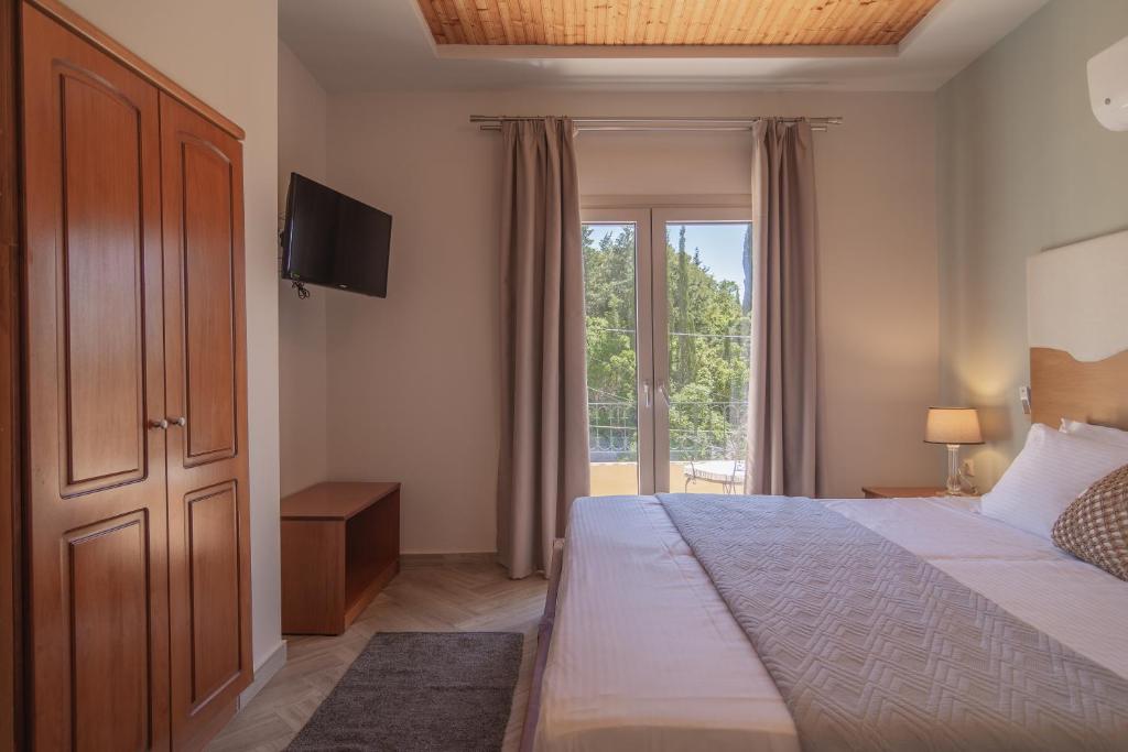 Postel nebo postele na pokoji v ubytování Aris Apartments