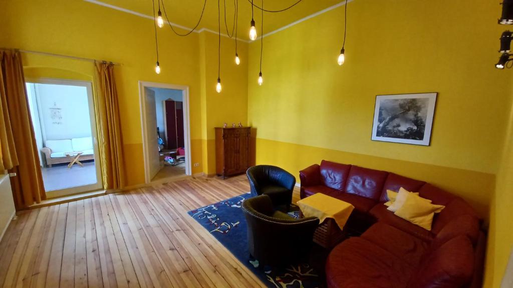 a living room with a couch and a chair at Designerwohnung Berlin Mitte in Berlin