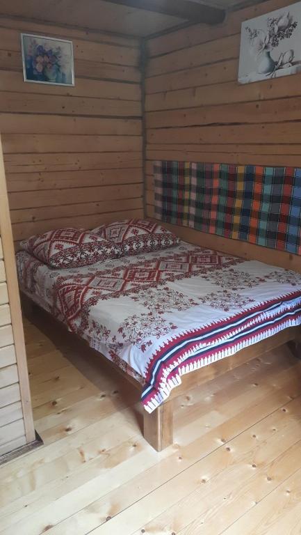 Postel nebo postele na pokoji v ubytování Крайня Хата