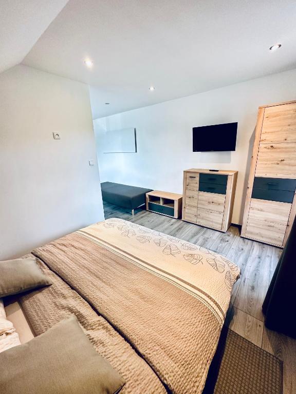 Postel nebo postele na pokoji v ubytování Apartmány na Horce
